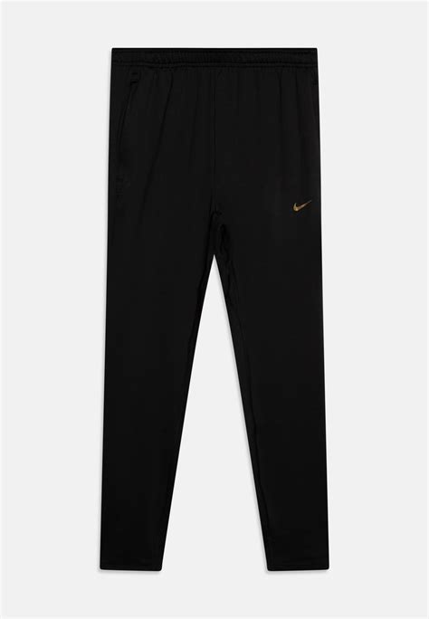 Nike Performance STRIKE PANT UNISEX - Tracksuit bottoms - black/metallic gold/black - Zalando.ie