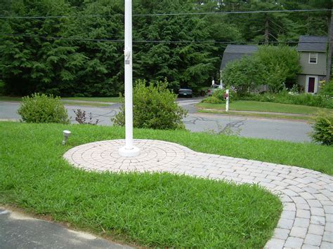 brick wail to flag pole | Front yard landscaping design, Cheap ...
