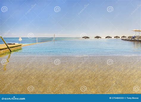 Infinity Pool on the Beach stock image. Image of vacation - 275484333