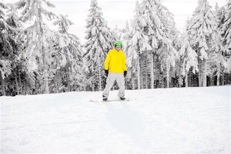 Man Snowboarding at the Mountains Stock Photo - Image of adult, action: 108652290