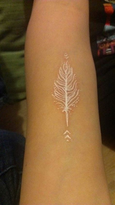 Cool white-ink-feather tattoo for women on arm. >> Find out more by clicking the photo | White ...