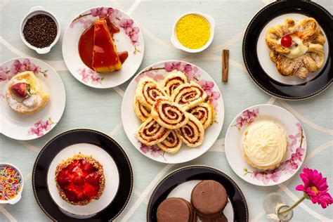 Variety of Baked and Dessert Foods on Plates · Free Stock Photo