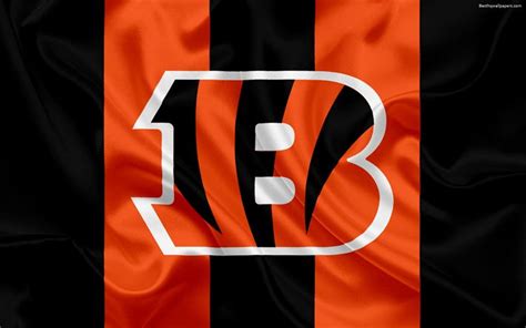 the letter b is painted on an orange and black striped fabric