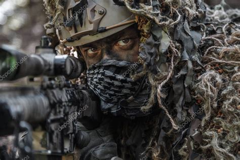 Sniper wearing ghillie suit Stock Photo by ©zabelin 129275376