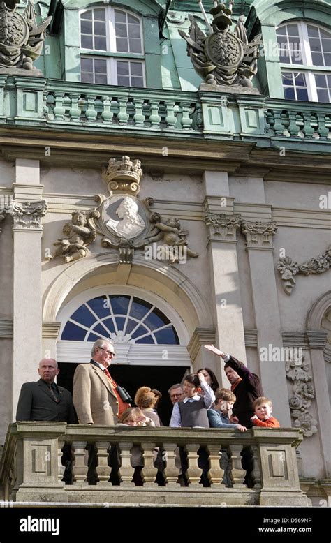 The Danish royal family stands on a balcony of the Eremitage Castle ...