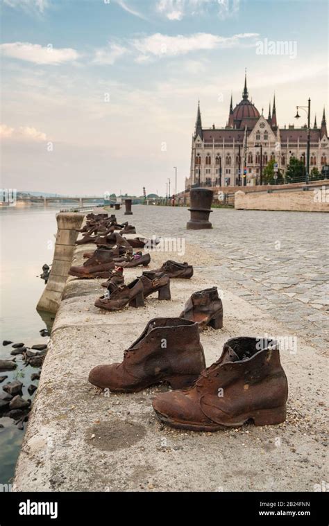 Shoes on the Danube Bank memorial with Budapest parliament building at background Stock Photo ...