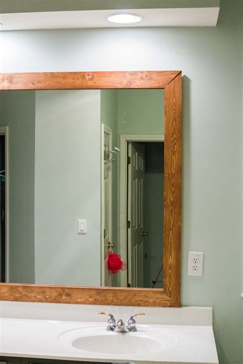 How to DIY Upgrade Your Bathroom Mirror With a Stained Wood Frame ...