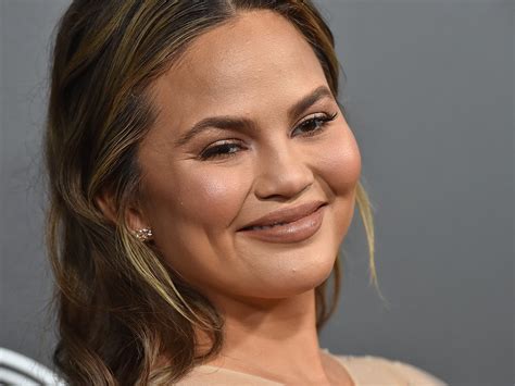 Chrissy Teigen Is One Of The Rare Celebs Embracing Her Grey Hair