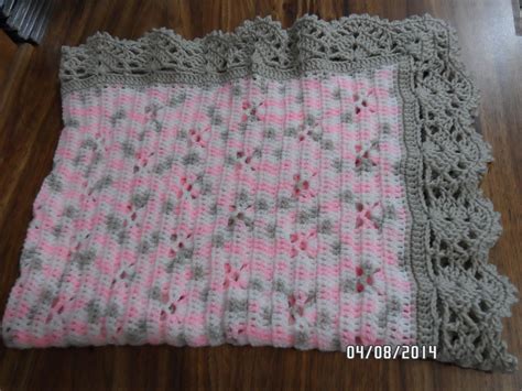 Baby blanket using Bernat Baby Sport Blossom and Taupe. The border turned… | Crochet baby ...