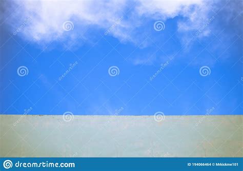 The Concrete Front Porch Of A House Is Seen With A Small American Flag ...