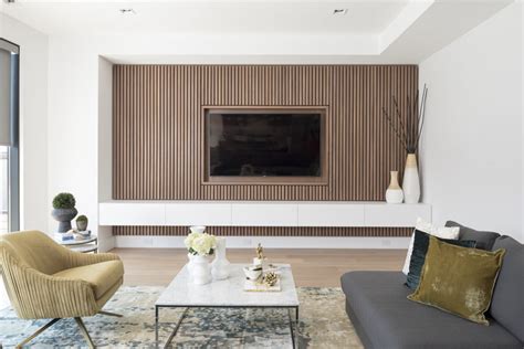 Design Detail - A Wood Slat Accent Wall Surrounds The TV In This Living ...