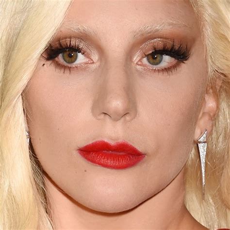 Lady Gaga Makeup: Brown Eyeshadow, Gold Eyeshadow & Red Lipstick | Steal Her Style