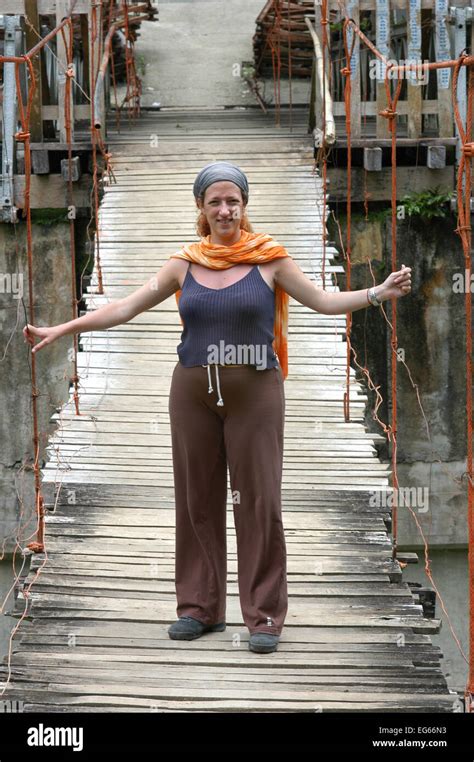 Tourist woman in a Bohol bridge. Philippines Bohol Tigbao Hanging Bridge Loboc River Visayas ...