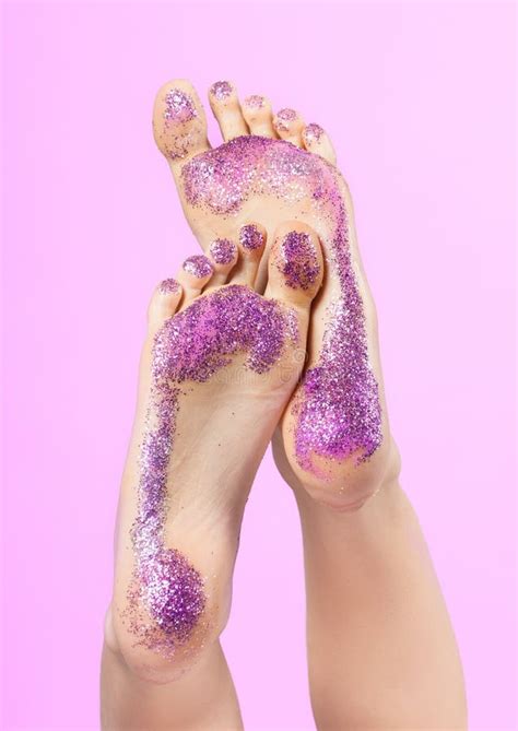 Female Feet Closeup. they are Raised and Covered with Colorful Sequins. Traces. Stock Photo ...