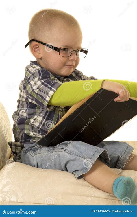 Young Boy with Glasses Reading Stock Photo - Image of little, emotion: 61416624