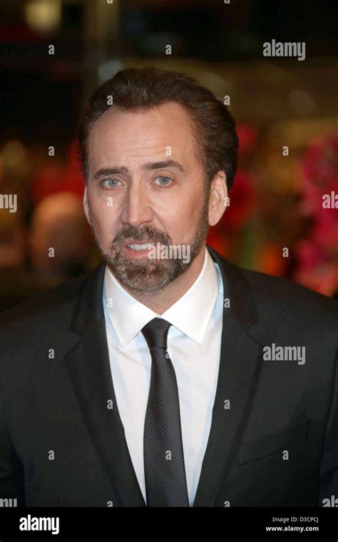 Actor Nicolas Cage arrives at the premiere of "The Croods" during the ...