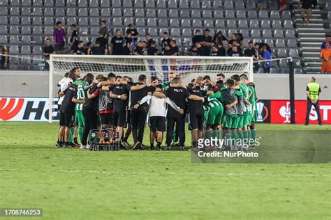 Aris Limassol players and staff gather at the center of the stadium... News Photo - Getty Images