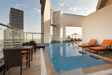 The top amenities of Ramada Abu Dhabi Corniche include a rooftop pool ...