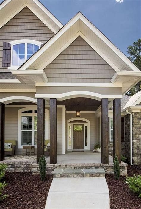 the front entrance to a house with columns and pillars