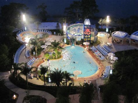 an aerial view of a resort pool at night