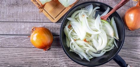 Premium Photo | White onion slices in pan for cooking and fresh white onion on gray ...