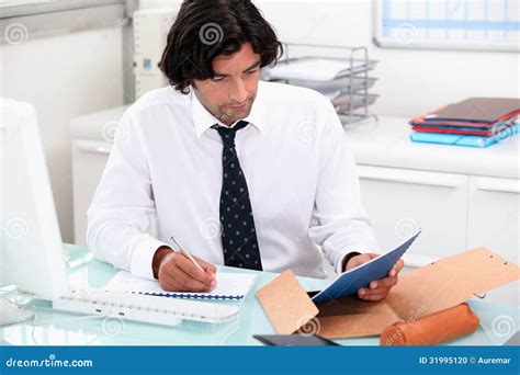 Man working at a desk stock photo. Image of clerk, male - 31995120