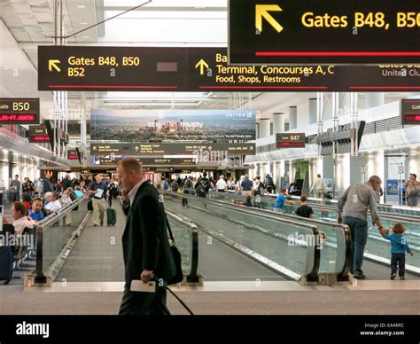 Airport Travelers, Moving Sidewalks and Gates, United Terminal, Denver International Airport, CO ...