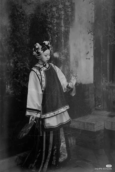 an old black and white photo of a woman in traditional chinese dress ...