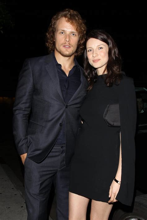 lovepollution (Caitriona Balfe and Sam Heughan pose for fans and...)