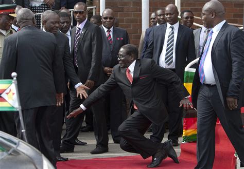 Zimbabwe dictator Mugabe falls down steps, photographers forced to delete images - Business Insider