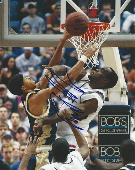 Autographed Emeka Okafor photo - UNIV OF CONNECTICUT - Main Line Autographs