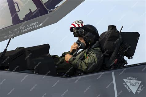 Premium Photo | A fighter pilot in the cockpit of a fighter jet with the words st. louis on the ...