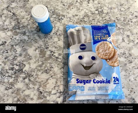 Orlando, FL/USA-12/31/19: Prepackaged Pillsbury sugar cookies and blue sprinkles ready to be ...