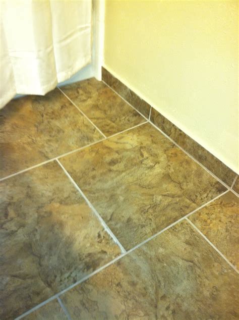 Cut tile to use as baseboards. An incredibly inexpensive option that ...