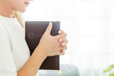 woman praying with bible 17027682 Stock Photo at Vecteezy