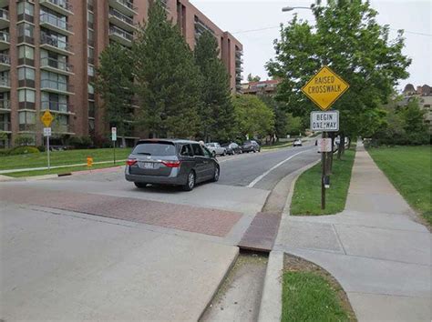 Figure 3.14.7. Raised Crosswalk Design to Accommodate Drainage. This figure contains a ...