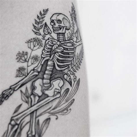 Skeleton between the flowers - Tattoogrid.net | Skeleton tattoos ...