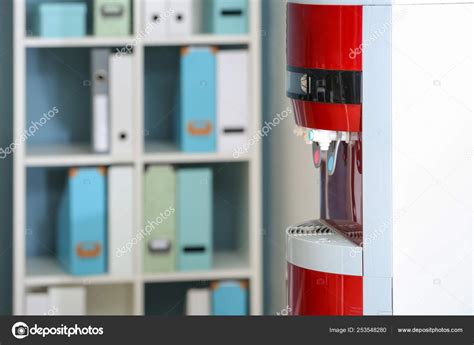 Modern water cooler in office, closeup Stock Photo by ©serezniy 253548280