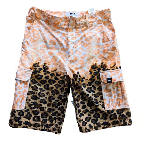 Funky animal print cargo shorts in size 31 from... - Depop