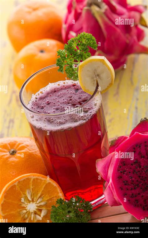 Red Dragon fruit and Orange Smoothie Stock Photo - Alamy