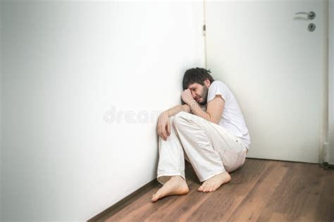 Lonely Sad Man Suffers From Depression And Crying On Floor Stock Image - Image: 63917201