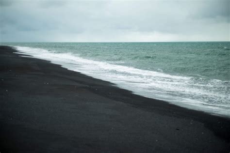 Why is the sand black in Iceland?