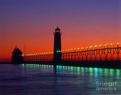 Grand Haven Lighthouse At Sunset Photograph by Larry Knupp