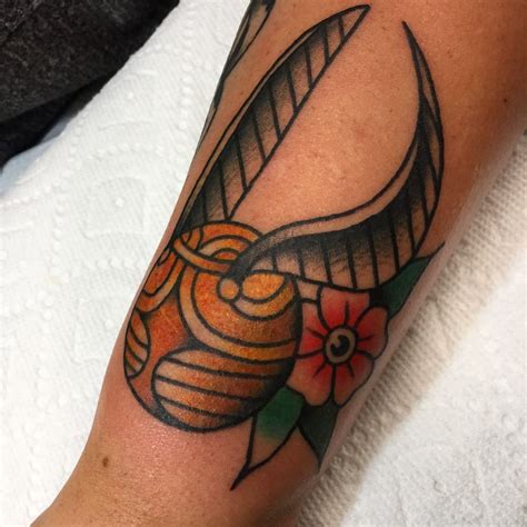 willandrew:golden-snitch-traditional-tattoo