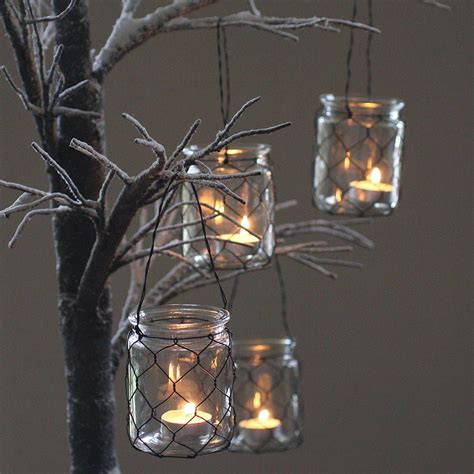 four hanging tea light holders by magpie living | notonthehighstreet.com | Hanging tea lights ...