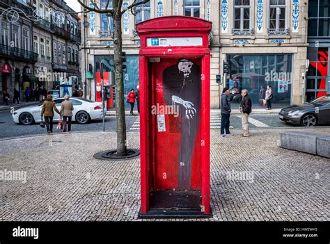 Old london style phone booth with graffiti in Santo Ildefonso district ...