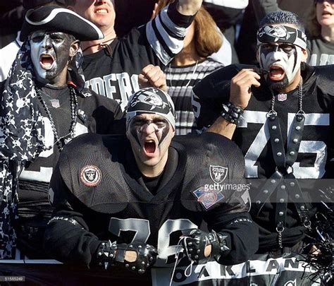 Oakland Raiders fans cheer in the stands during their AFC... | Oakland raiders, Raiders fans ...