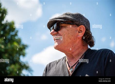 Namur, Belgium. 16th June, 2023. AC/DC lead singer Brian Johnson reveals a statue of his ...