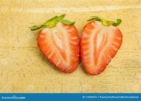 Strawberry is cut in half. stock image. Image of fruit - 112030331