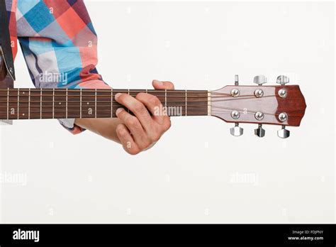 Fingerboard of guitar and hand playing guitar Stock Photo - Alamy